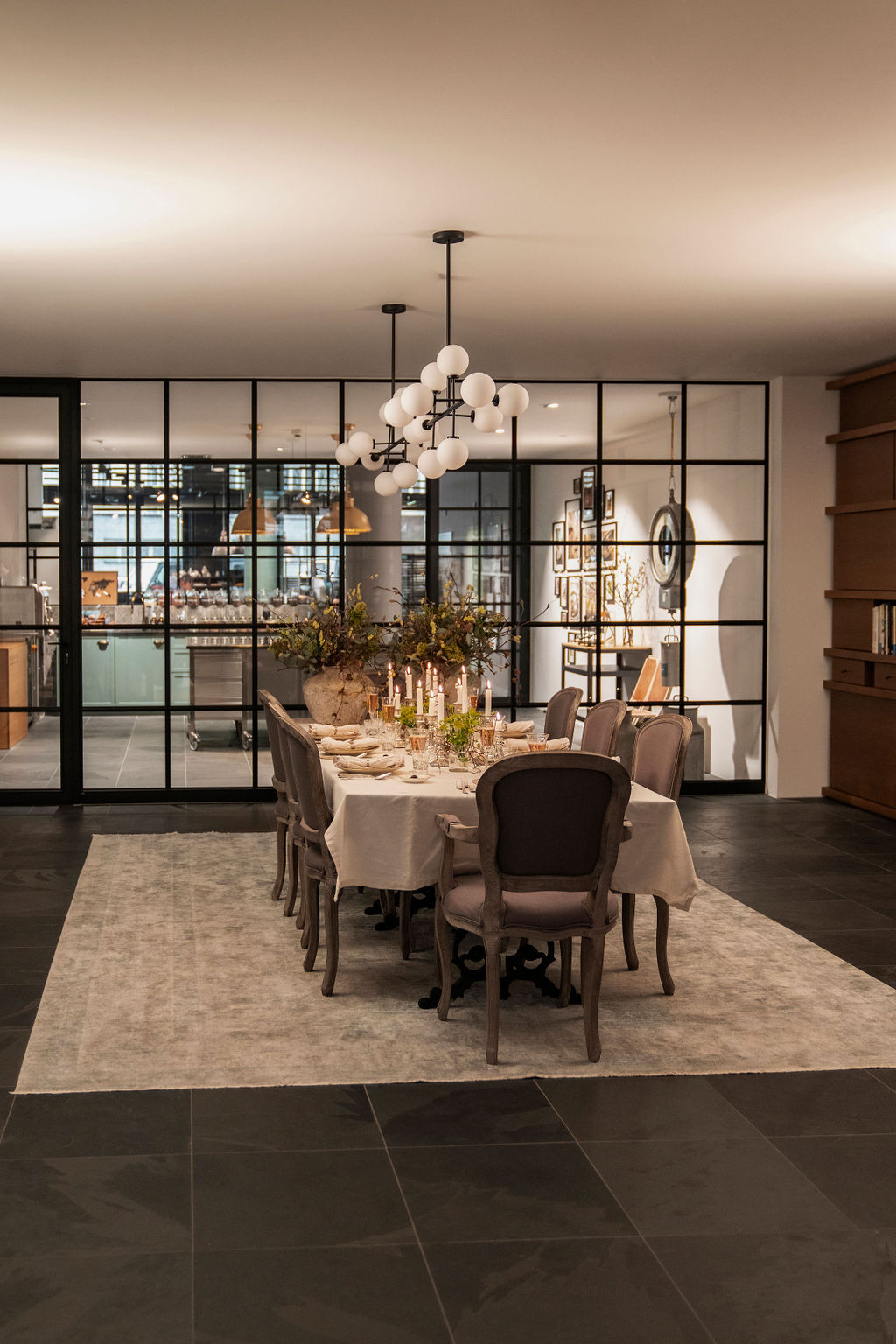 Elegant tasting table with dishes, candles, and refined décor inside a luxury chocolate event studio